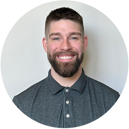 Vince Bendotti, a Registered Dietitian at the Saint Joseph PACE center in Indiana, wearing a dark gray collared shirt and standing against a plain light-colored background.